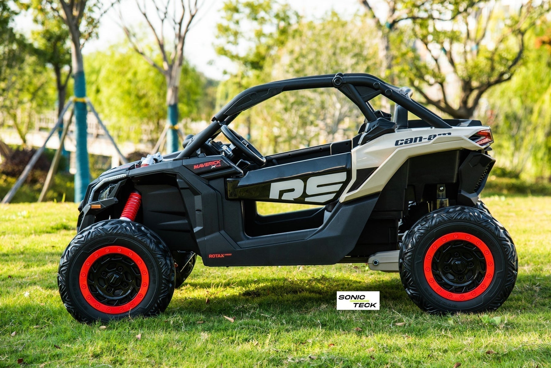Licensed 24V Can-Am Maverick kids ride-on UTV by SonicTeck featuring 4x4 motors, EVA rubber tires, leather seats, LED lights, and premium off-road styling in Canada