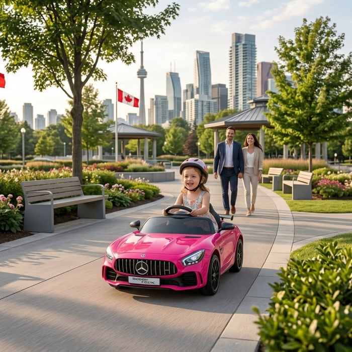 child riding a Pink Mercedes Benz GTR 12V Kids ride-on in a park 