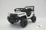 A white and black children's electric ride-on toy jeep with rugged tires, a roll bar, and a front bumper, photographed on a light gray studio background. The Sonic Tech logo is visible in the bottom right corner.