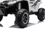 Close-up of the rubber tires on the Apex XXL 24V ride-on UTV.