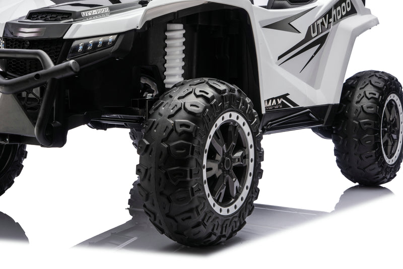 Close-up of the rubber tires on the Apex XXL 24V ride-on UTV.