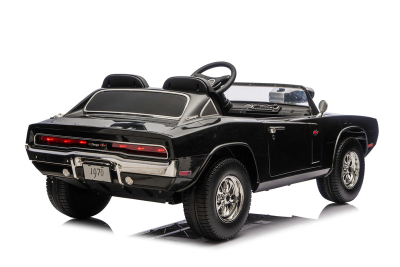 A black 1970 Dodge Charger muscle car ride-on toy vehicle, photographed from a rear three-quarter angle on a clean white background.
