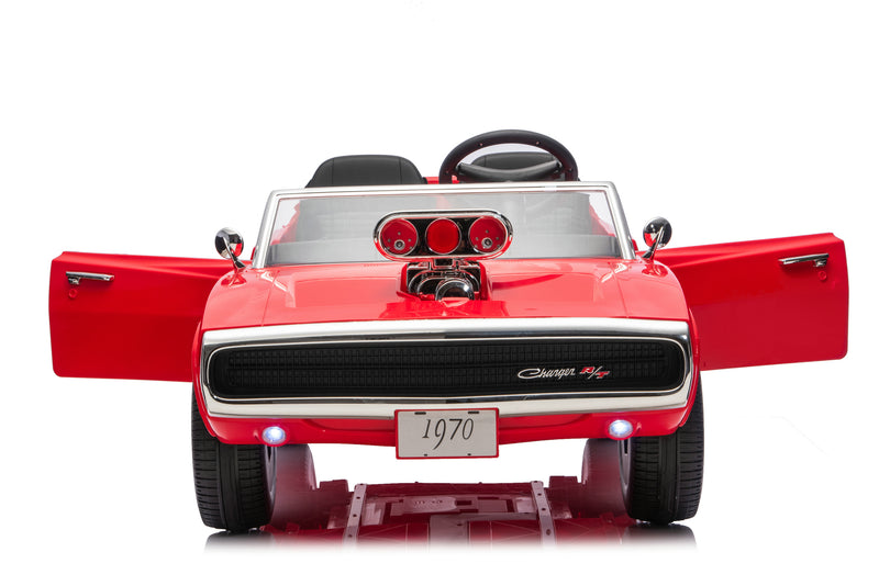A red 1970 Charger R1/4 scale electric ride-on toy car with open doors, black seats, and a chrome grille, shown from the front on a white background.