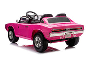 A bright pink convertible ride-on toy car styled like a classic muscle car, shown from a three-quarter rear angle on a white background.