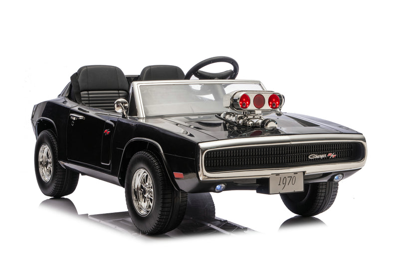 A black toy ride-on muscle car replica with chrome details, a raised engine hood, and a clear windshield, photographed on a white background.