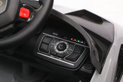 Dashboard with music controls inside Licensed Lamborghini Huracán STJ ride-on