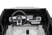 Close-up of Mercedes G63 ride-on SUV showing durable rubber tires and realistic G-Wagon styling.