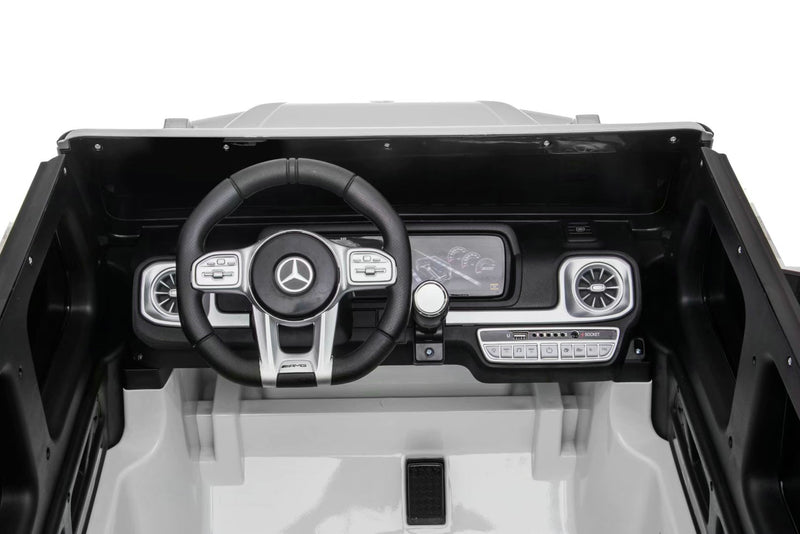 Close-up of Mercedes G63 ride-on SUV showing durable rubber tires and realistic G-Wagon styling.