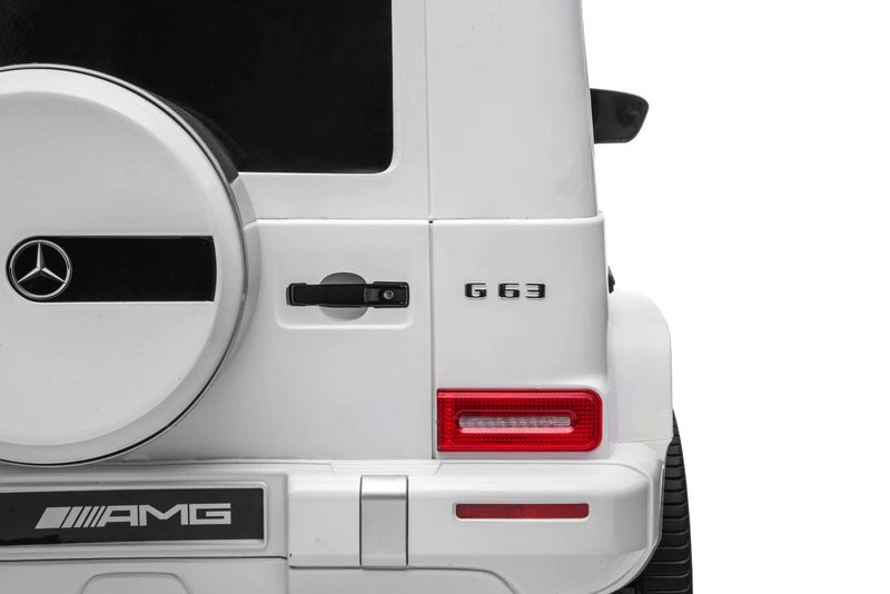 Side profile of Mercedes G63 24V two-seater ride-on SUV with rubber tires and premium leather seats for kids.
