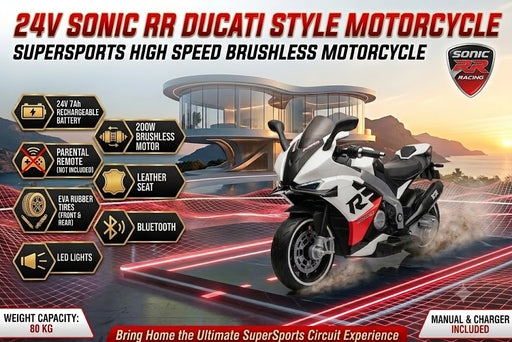 White, black, and red Sonic RR Ducati-style 24V kids ride-on supersports motorcycle with aerodynamic fairings, leather seat, and rubber tires on a futuristic race circuit at sunset