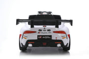 A white Toyota Supra GT-R licensed ride-on toy car, photographed from the rear on a clean white studio background with a subtle reflection.