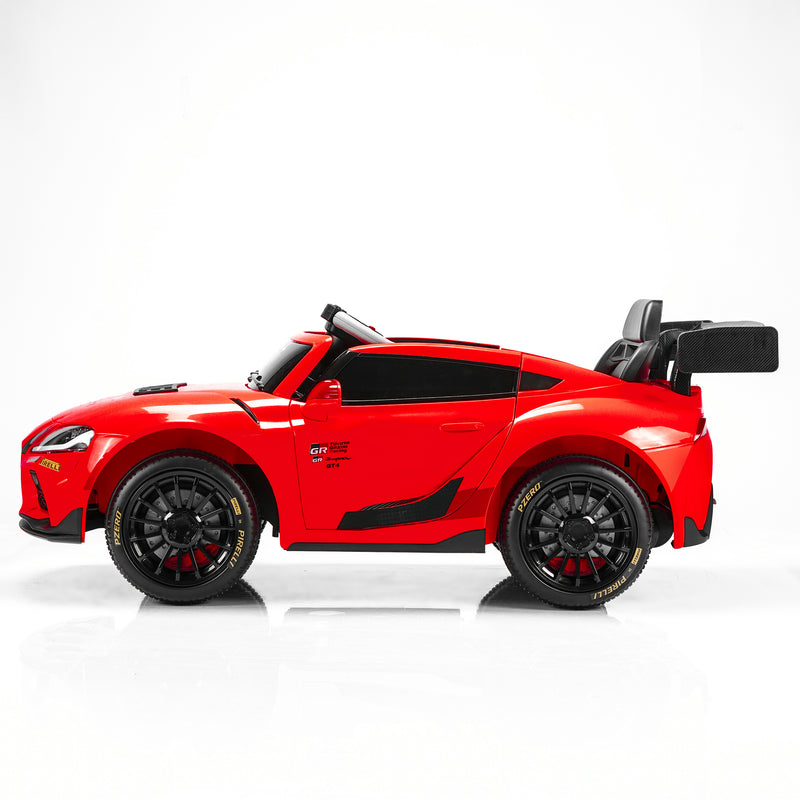 A red toy sports car with black wheels, a black windshield, and a black rear spoiler, shown in a side profile on a white studio background.