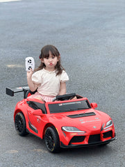 Red Colour Toyota GR Supra GT4 ride-on car with a big child inside