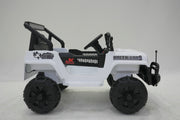 Close-up of wheels and tires on white ride-on Jeep Wrangler