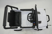 Parent using remote control with white ride-on Jeep Wrangler